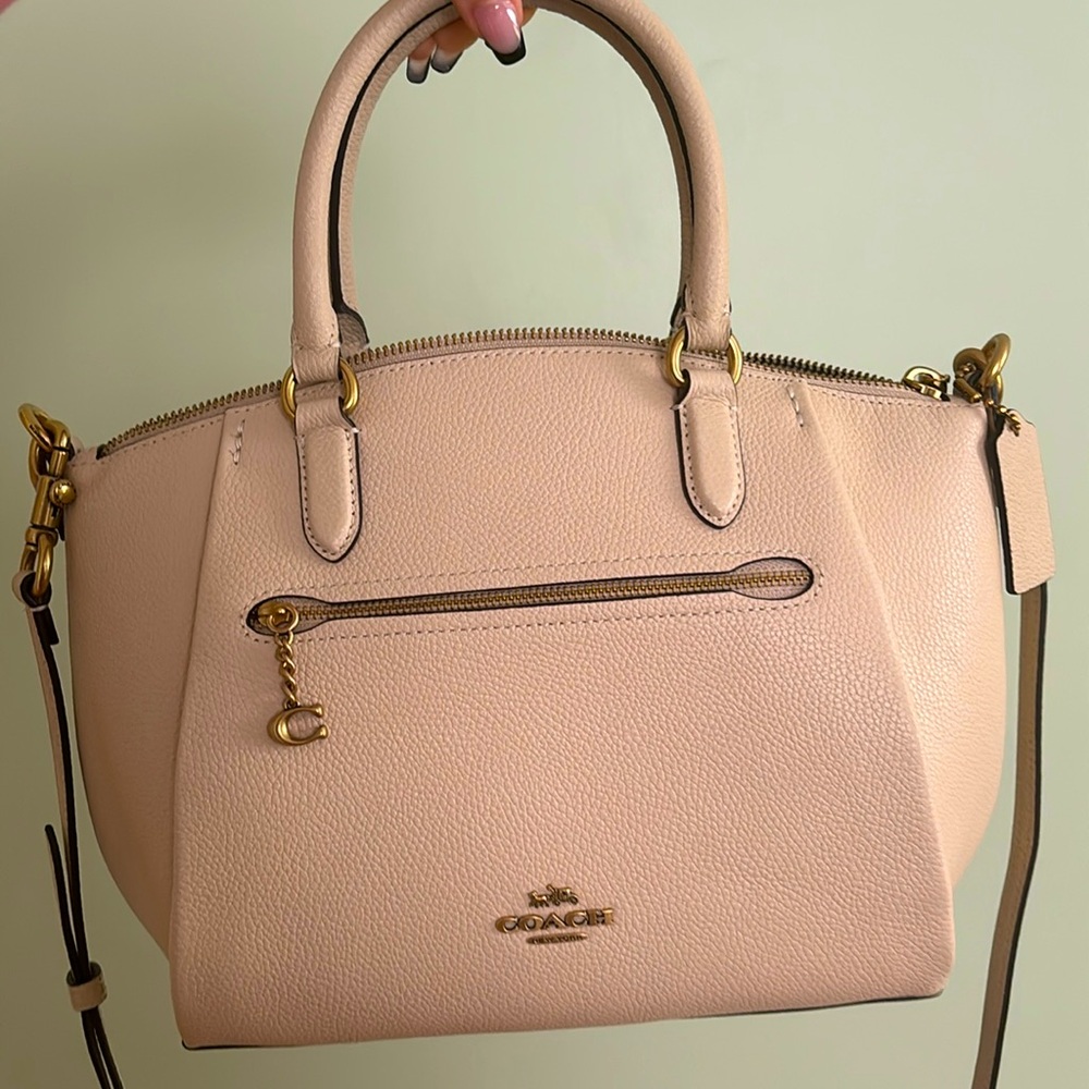 New never used Medium-Large cream colored coach bag with coach drawstring bag.